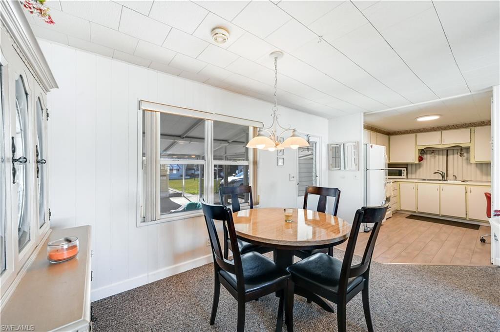 11 Moonstone Circle Naples, FL 34112 - Photo 5 of 20 a dining room with furniture and window