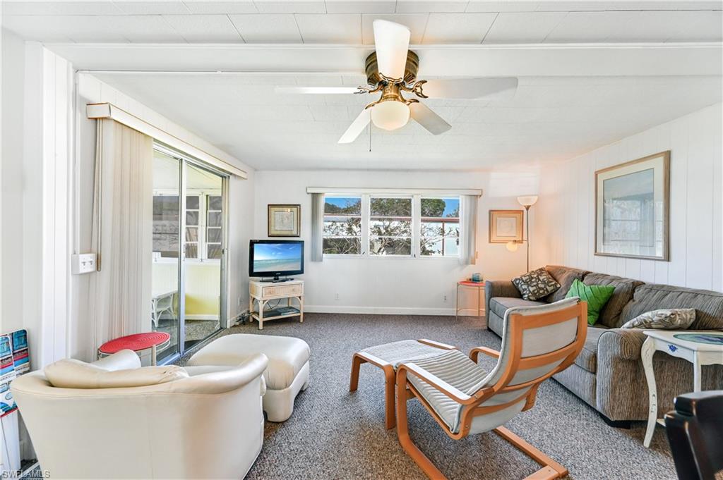 11 Moonstone Circle Naples, FL 34112 - Photo 7 of 20 a living room with furniture and a window