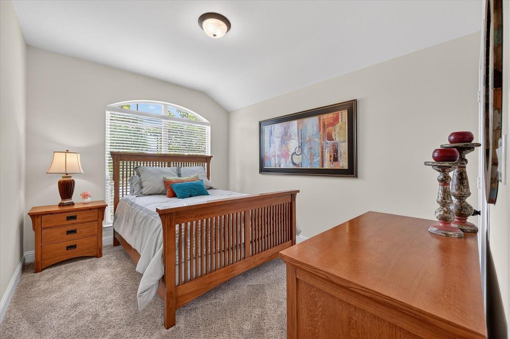 106 Zion Lane Forney, TX 75126 - Photo 20 of 37 a bedroom with furniture and a window