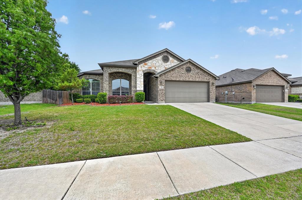 106 Zion Lane Forney, TX 75126 - Photo 2 of 37 a front view of a house with yard and green space