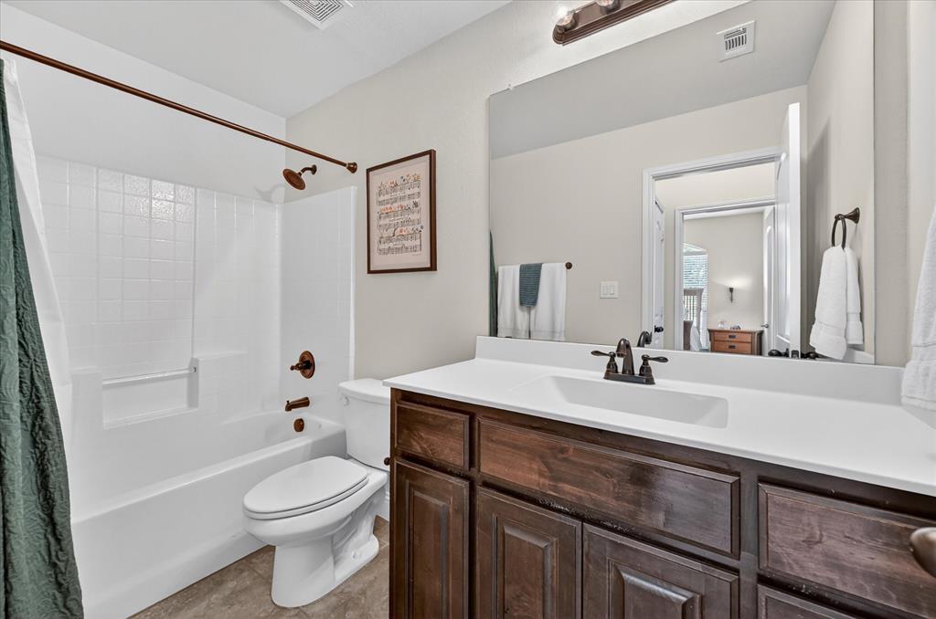 106 Zion Lane Forney, TX 75126 - Photo 22 of 37 a bathroom with a sink a toilet and a mirror