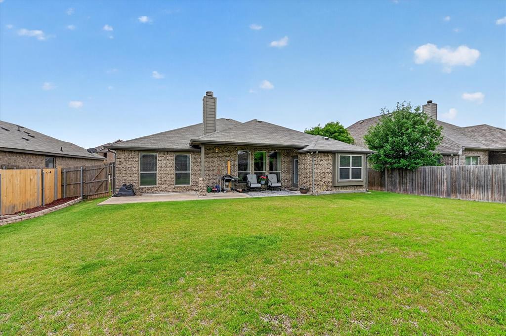 106 Zion Lane Forney, TX 75126 - Photo 25 of 37 a front view of a house with a garden