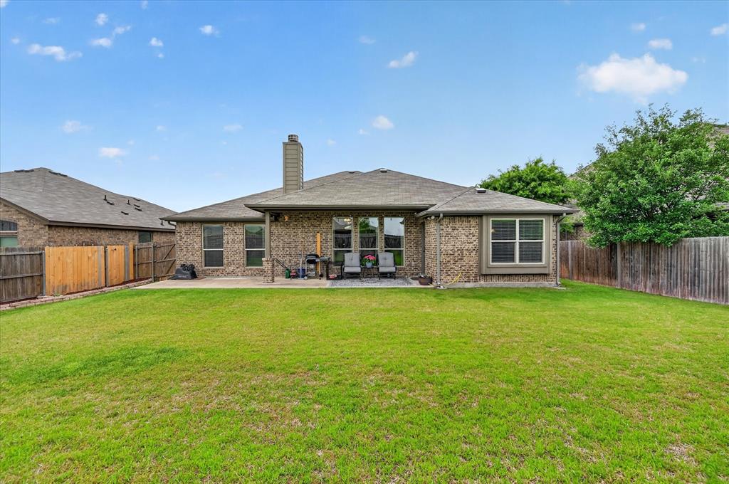 106 Zion Lane Forney, TX 75126 - Photo 26 of 37 a front view of a house with a garden