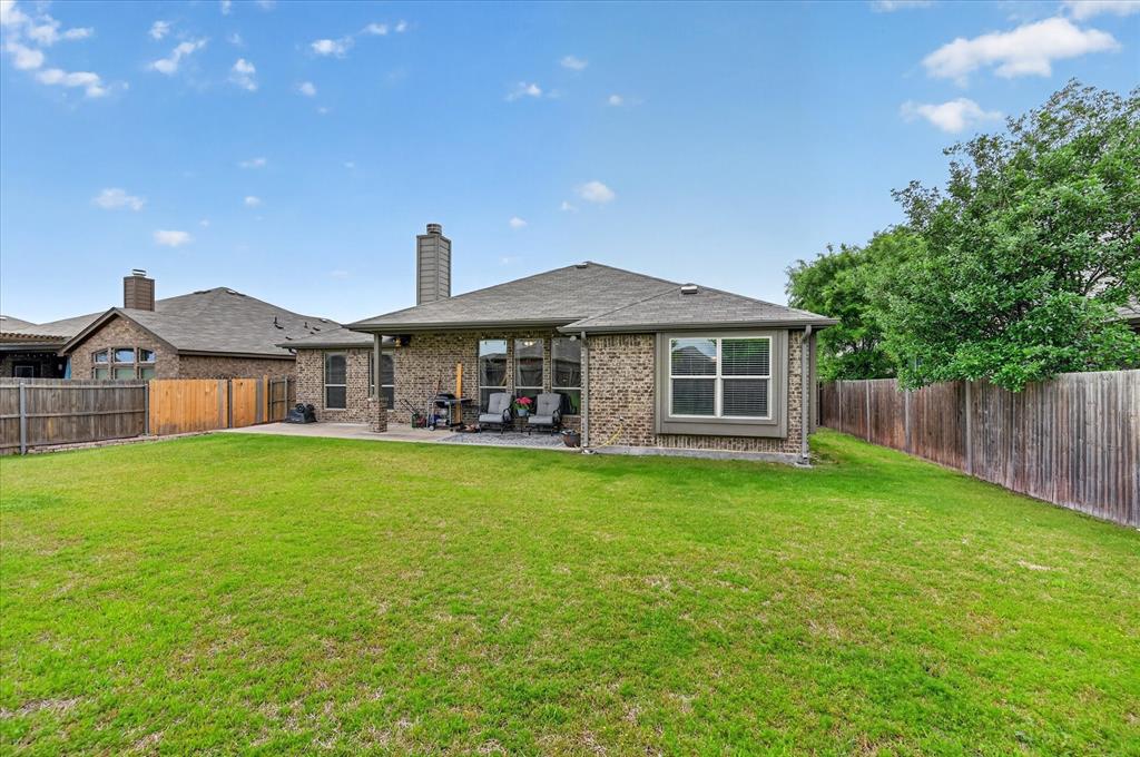 106 Zion Lane Forney, TX 75126 - Photo 27 of 37 a front view of a house with a garden
