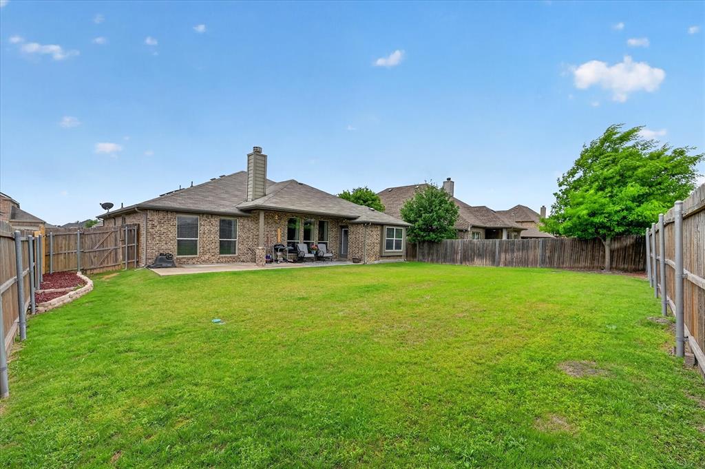 106 Zion Lane Forney, TX 75126 - Photo 28 of 37 a front view of a house with garden