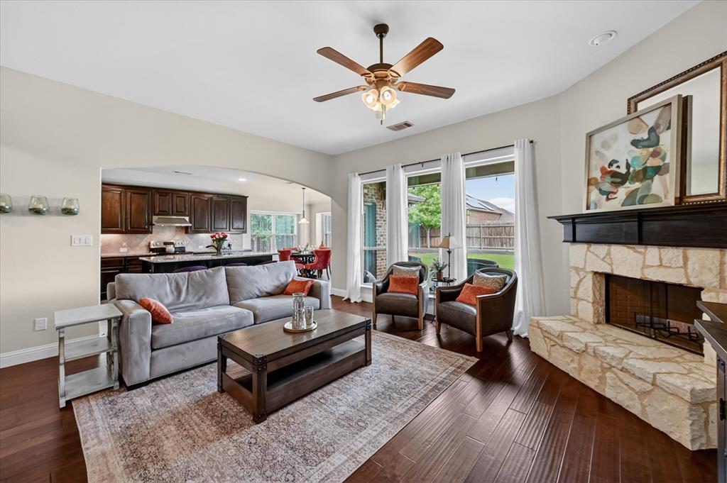 106 Zion Lane Forney, TX 75126 - Photo 5 of 37 a living room with furniture and a fireplace