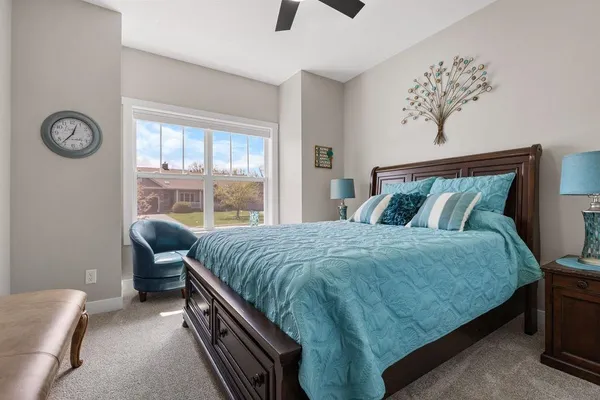 a bedroom with a bed and a table in it