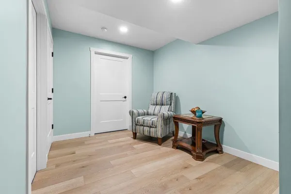 a bedroom with a bed and a chair