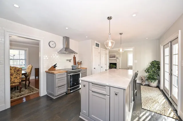 a kitchen with a stove a sink and a refrigerator