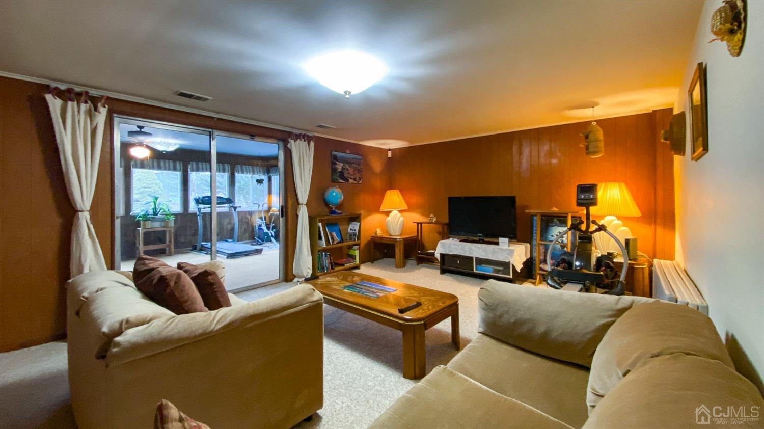 61 Stephenville Parkway Edison, NJ 08820 - Photo 12 of 32 a living room with furniture and a flat screen tv