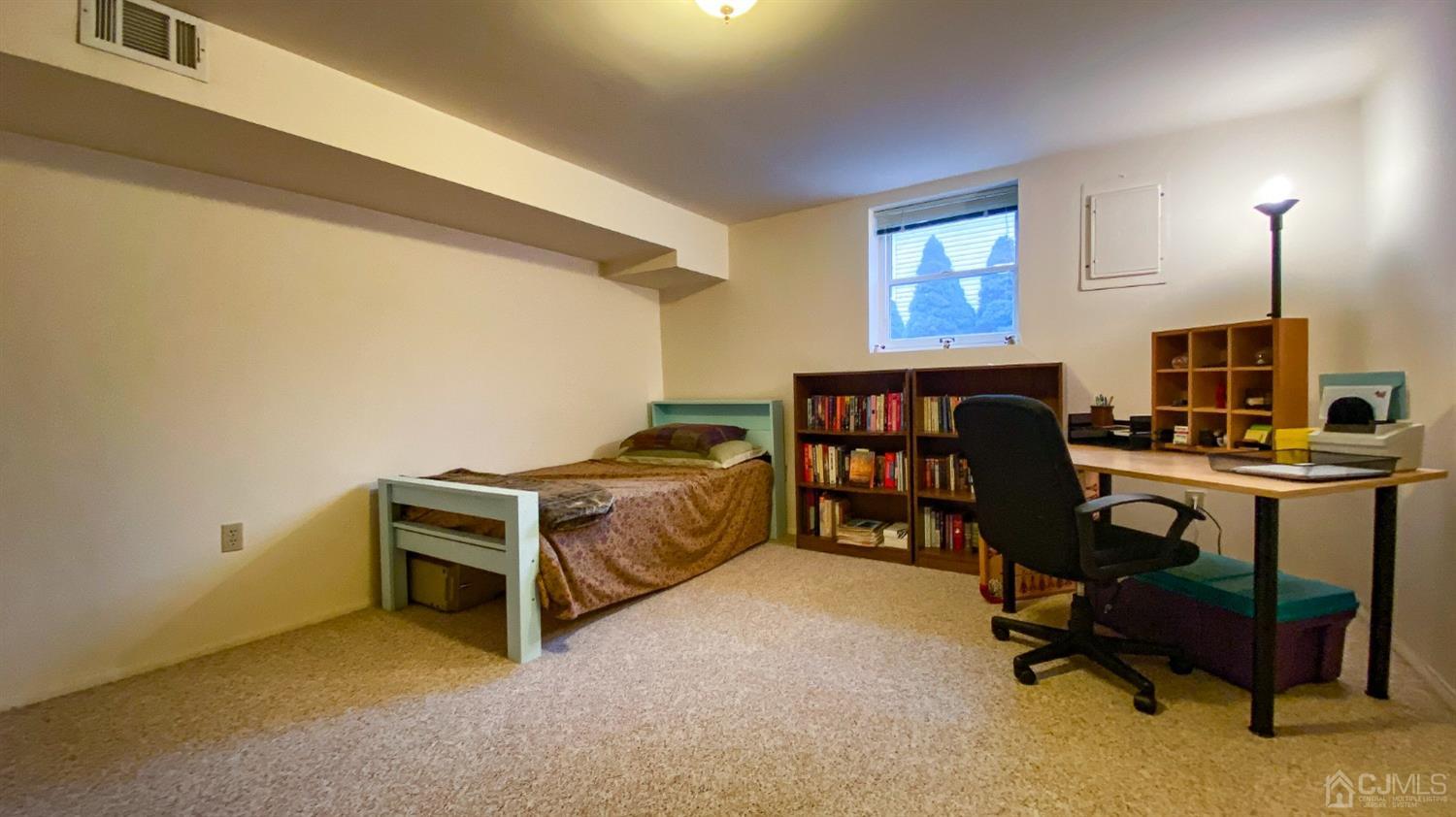 61 Stephenville Parkway Edison, NJ 08820 - Photo 16 of 32 a view of a workspace with furniture and a window