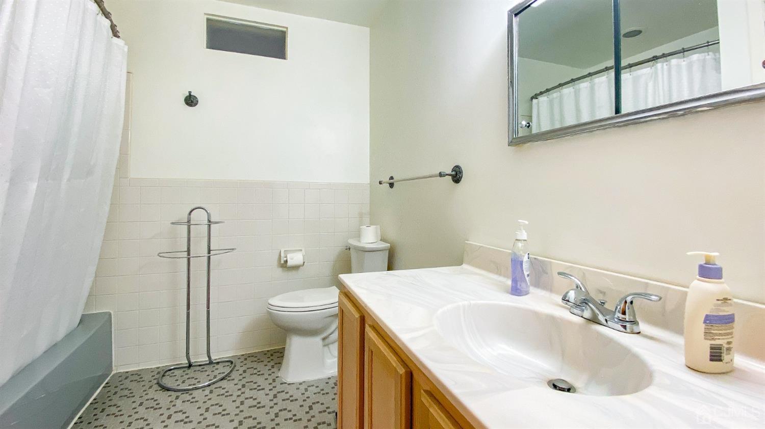 61 Stephenville Parkway Edison, NJ 08820 - Photo 22 of 32 a bathroom with a sink toilet and shower