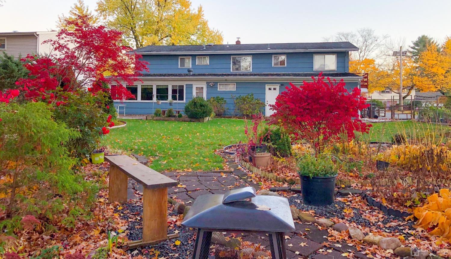 61 Stephenville Parkway Edison, NJ 08820 - Photo 23 of 32 a view of a house with a yard and sitting area