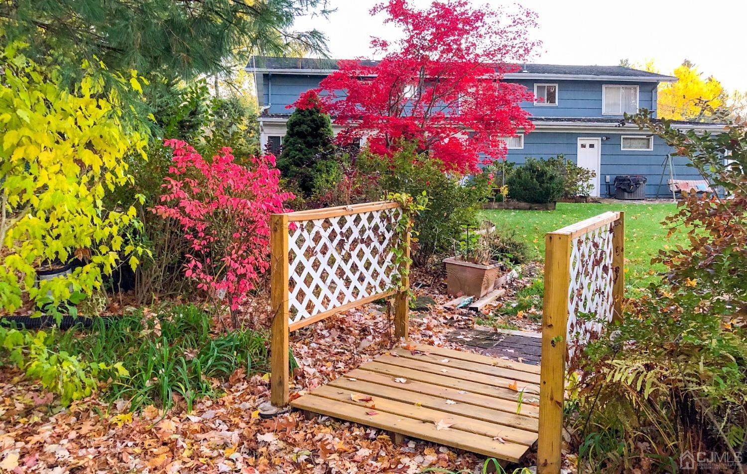 61 Stephenville Parkway Edison, NJ 08820 - Photo 24 of 32 a view of a bench in front of house