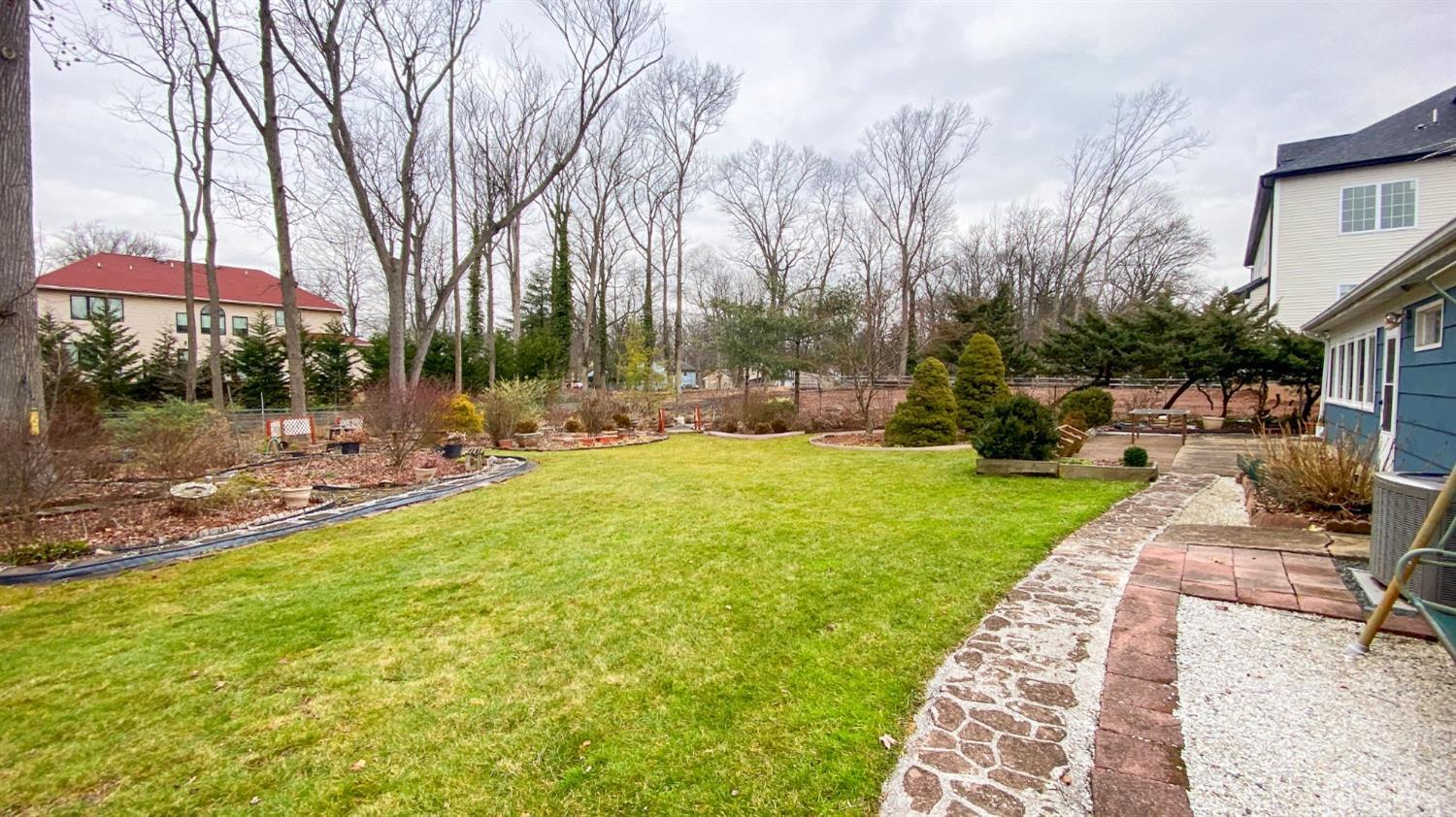 61 Stephenville Parkway Edison, NJ 08820 - Photo 25 of 32 a view of a patio with a yard