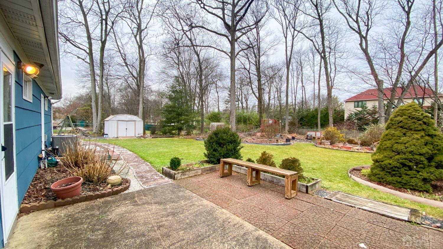 61 Stephenville Parkway Edison, NJ 08820 - Photo 27 of 32 a view of backyard with swimming pool and outdoor seating