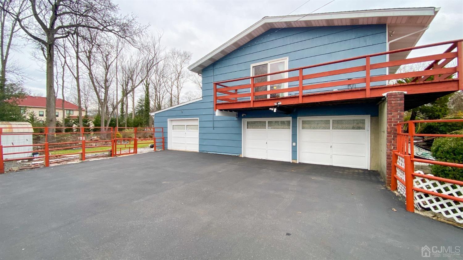 61 Stephenville Parkway Edison, NJ 08820 - Photo 3 of 32 a view of a house with a garage