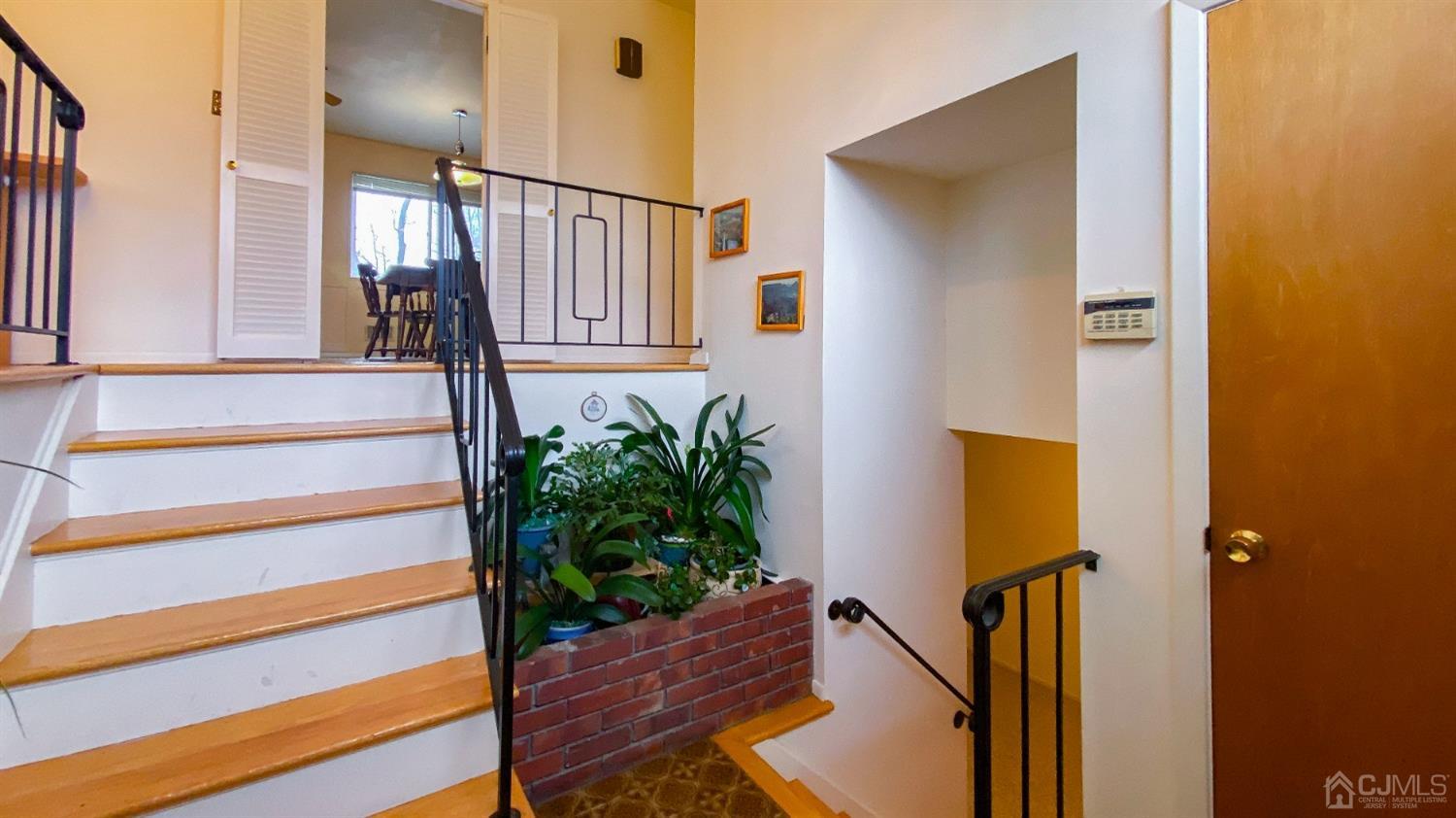 61 Stephenville Parkway Edison, NJ 08820 - Photo 4 of 32 a view of entryway and hall with wooden floor