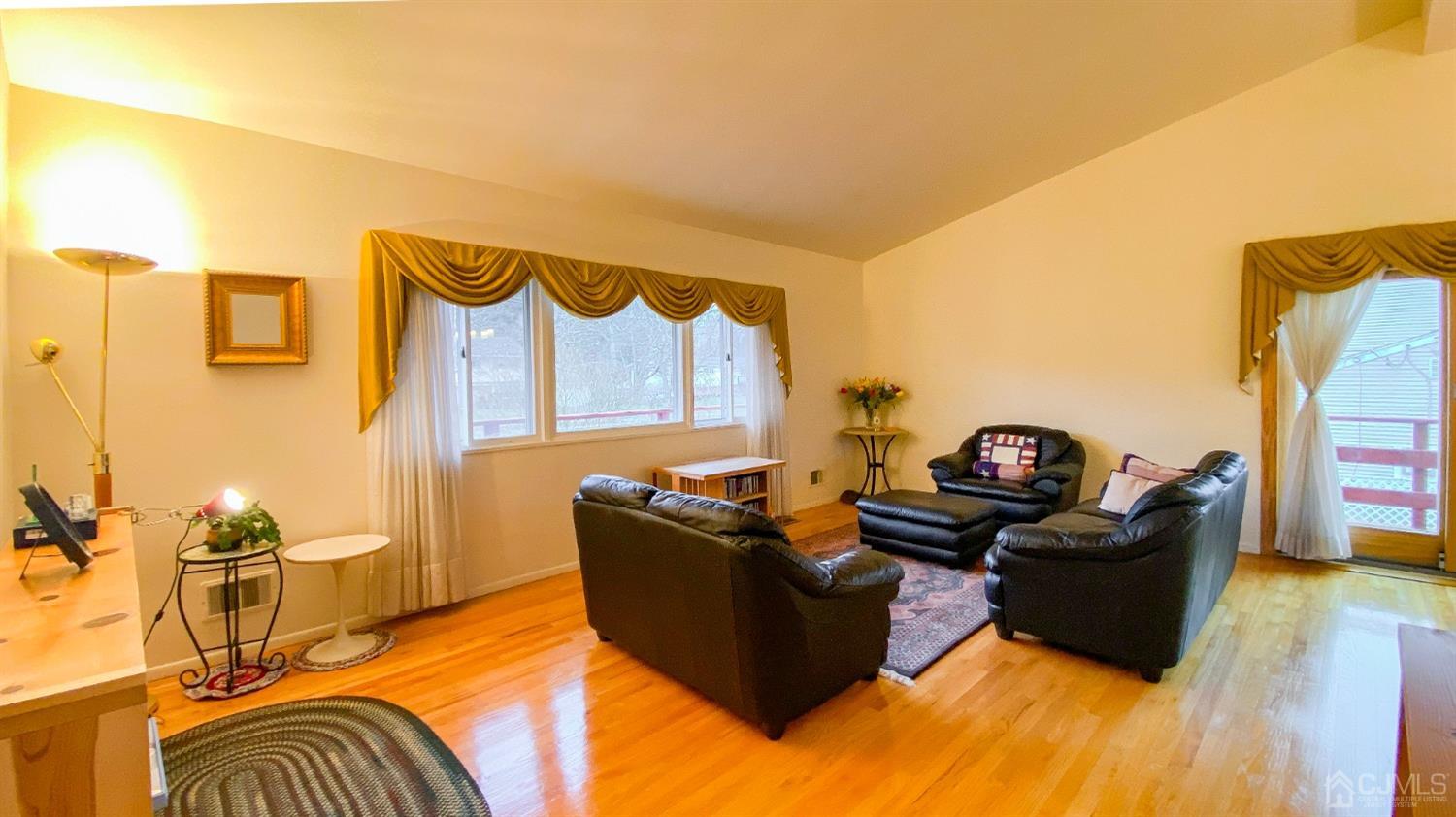 61 Stephenville Parkway Edison, NJ 08820 - Photo 5 of 32 a living room with furniture fireplace and a flat screen tv