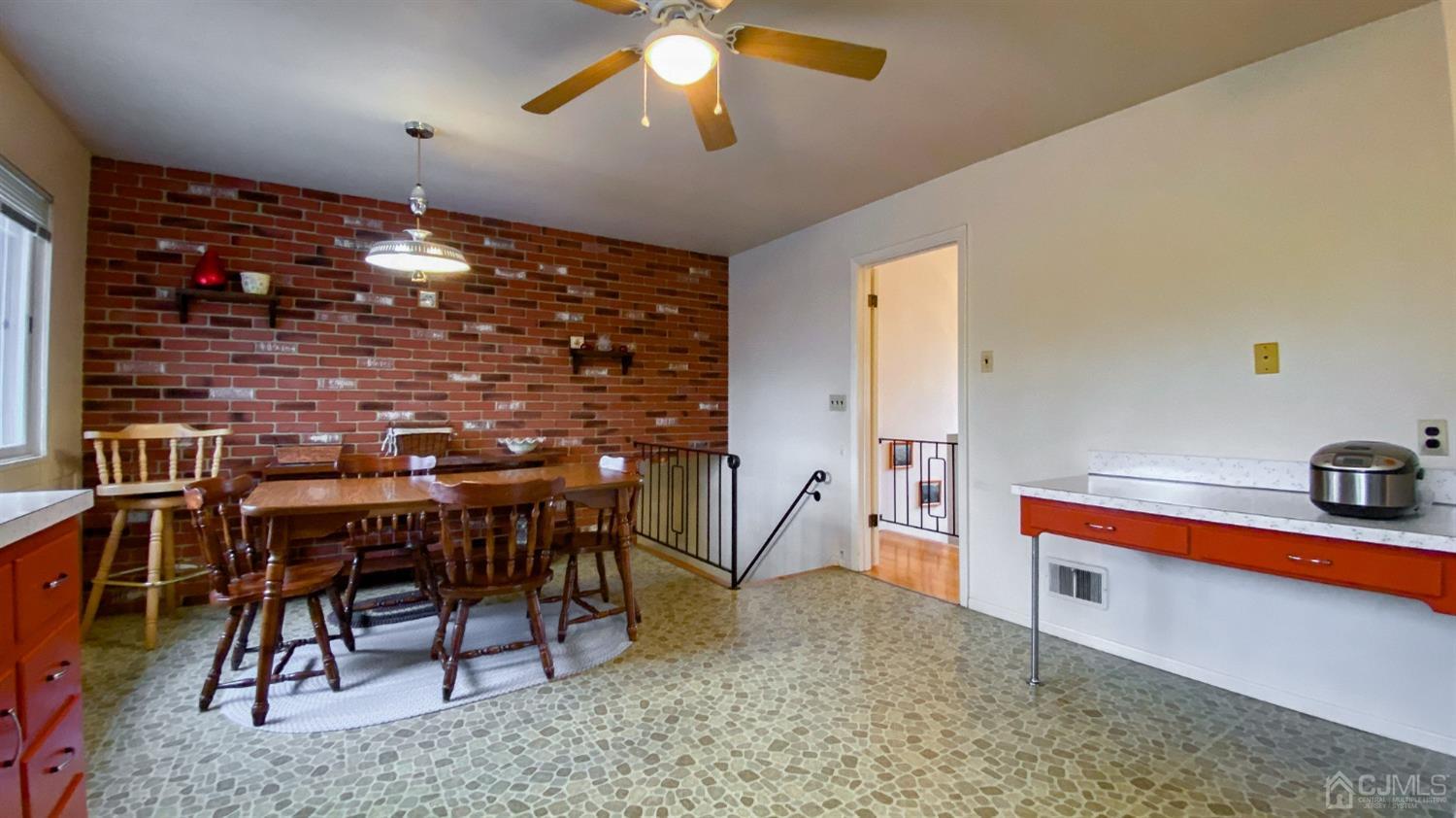 61 Stephenville Parkway Edison, NJ 08820 - Photo 10 of 32 a dining room with furniture and window