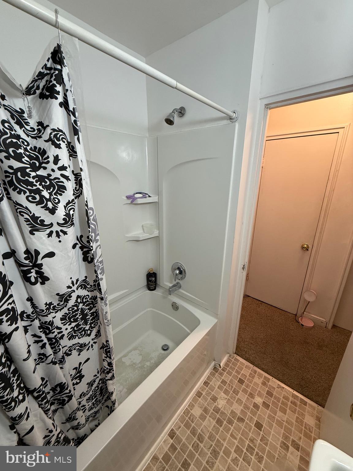 2112 Seneca Road Wilmington, DE 19805 - Photo 16 of 26 a bathroom with a bathtub and shower