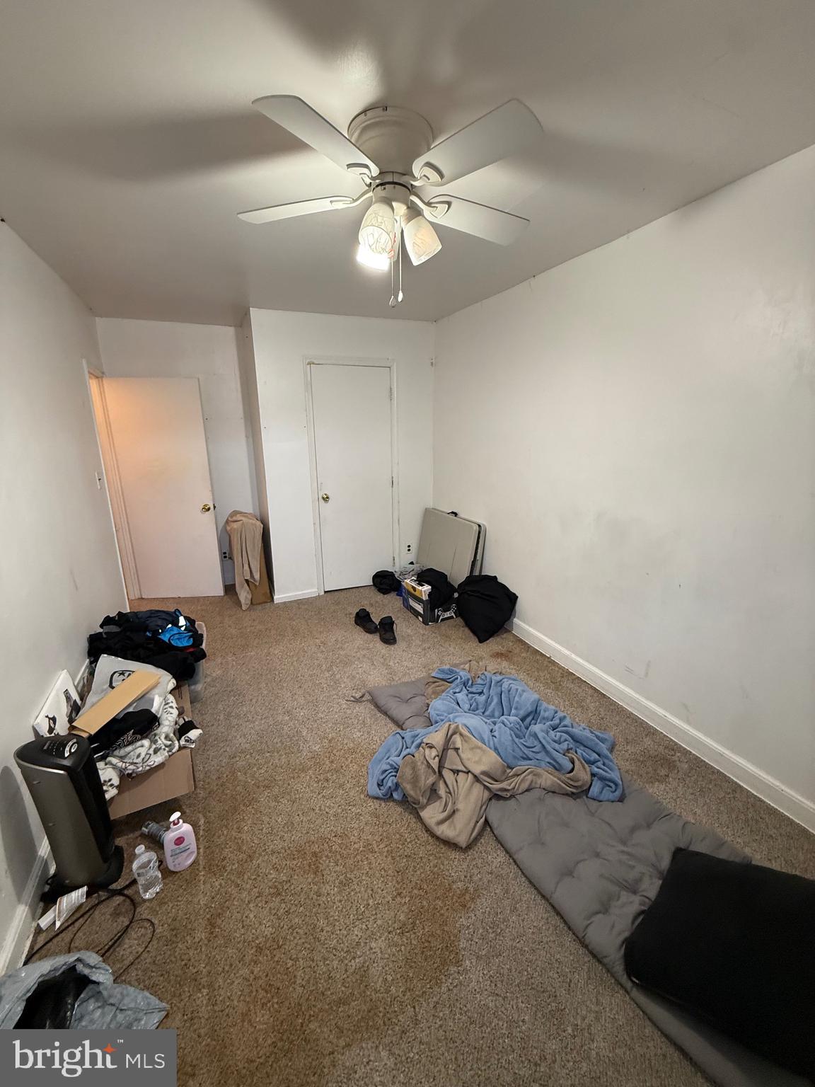 2112 Seneca Road Wilmington, DE 19805 - Photo 18 of 26 a bedroom with a bed and a chandelier