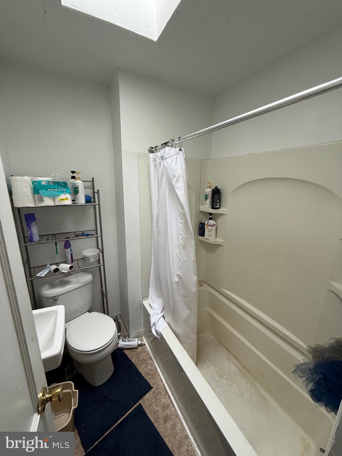 2112 Seneca Road Wilmington, DE 19805 - Photo 7 of 26 a bathroom with a toilet and a shower