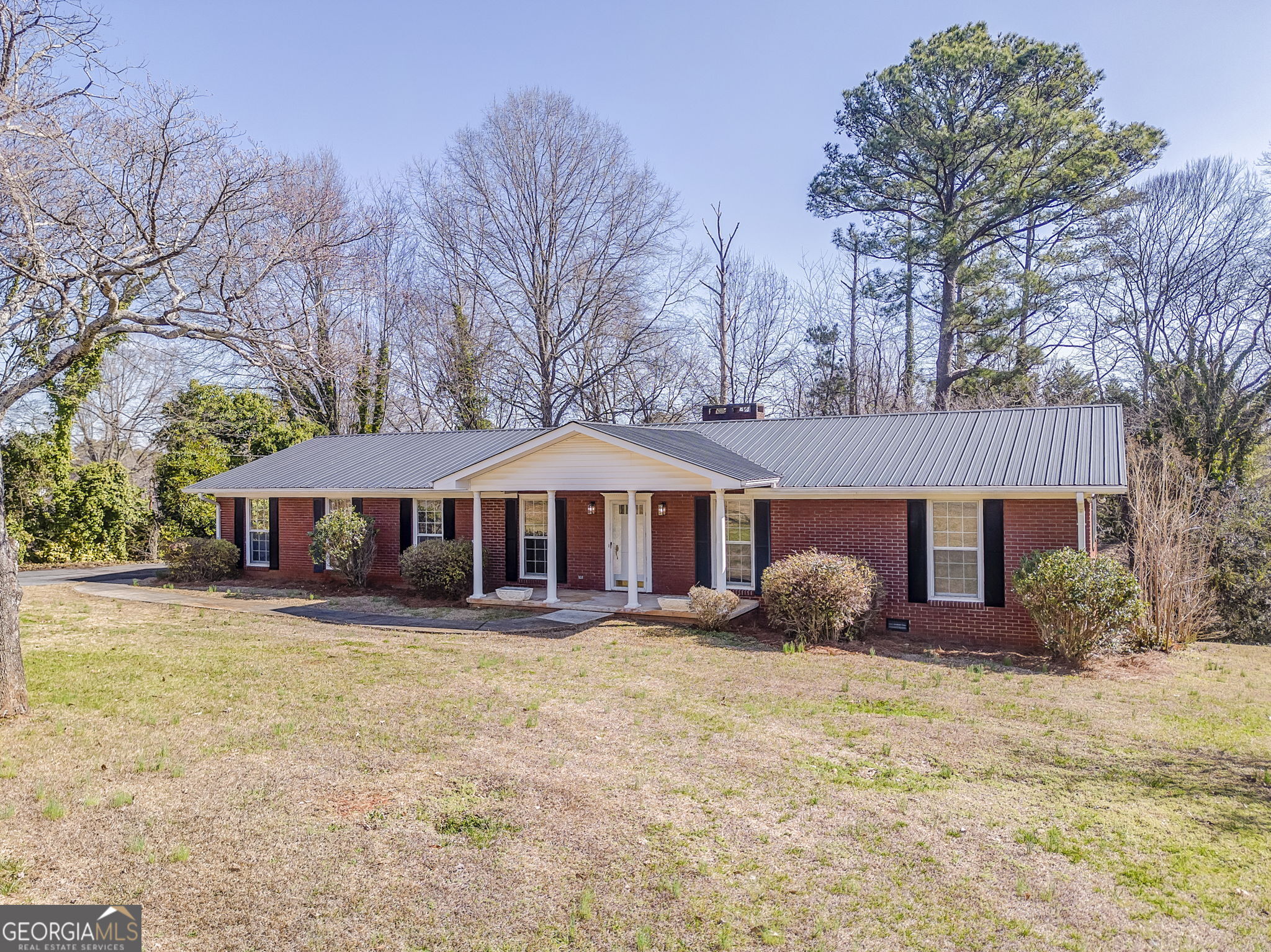 115 Devonwood Drive Calhoun, GA 30701 - Photo 1 of 1 a front view of a house with garden