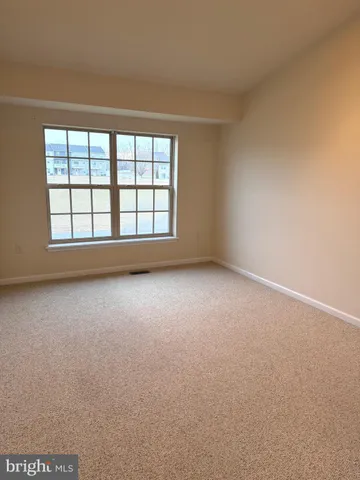 an empty room with a windows