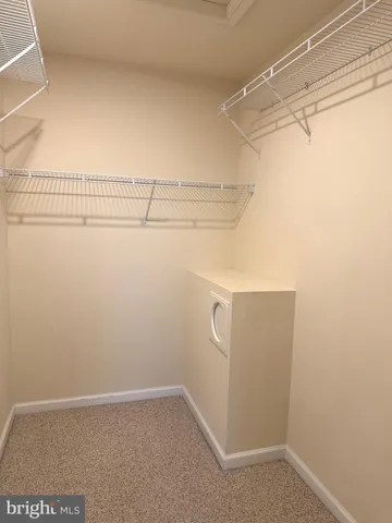 a view of a room with racks on the wall