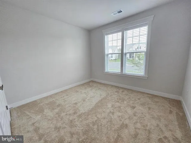a bathroom with a double vanity sink toilet and a mirror