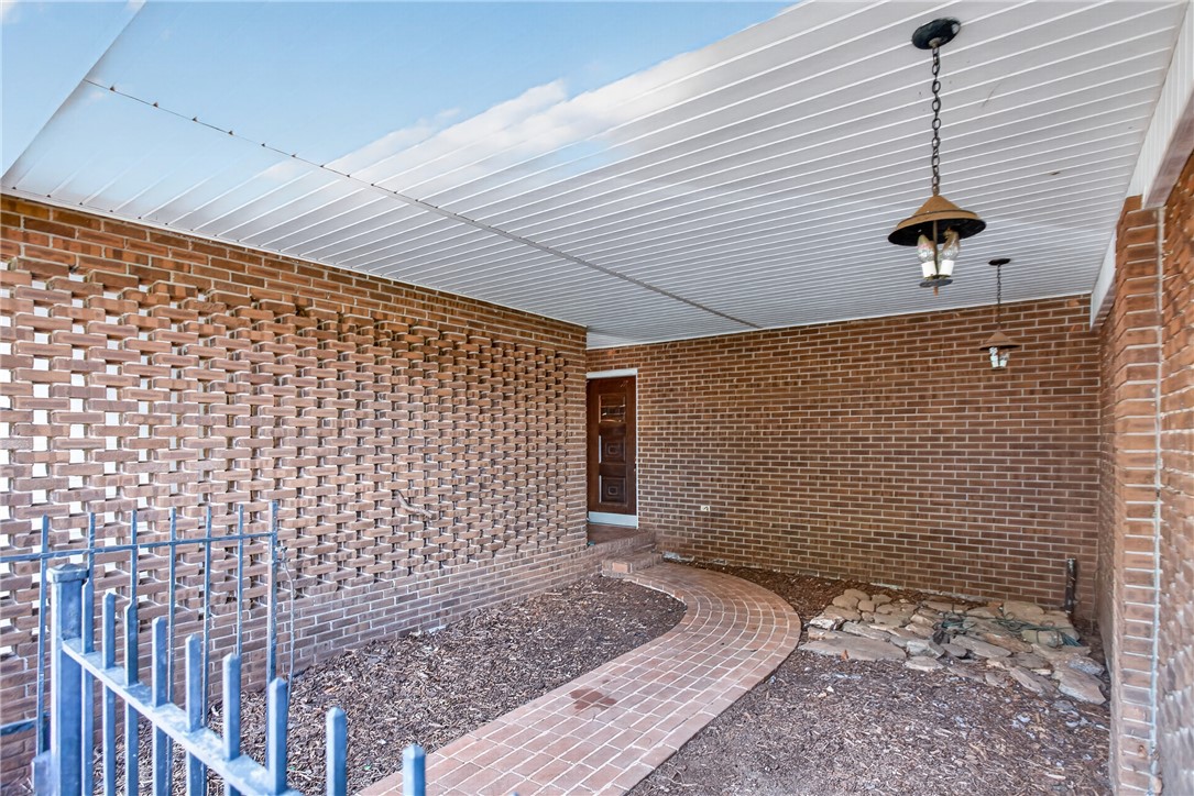 1412 Simpson Road Pendleton, SC 29670 - Photo 35 of 48 A brick exterior with a distinctive lattice pattern offers a private entry path leading to the front door.