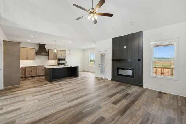 a view of a kitchen with a sink and a stove top oven