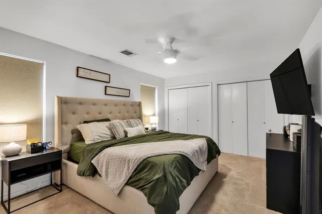 a living room with furniture fireplace and a flat screen tv