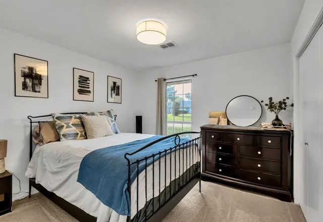 a bathroom with a sink vanity and toilet