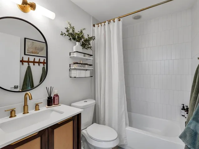 a bathroom with a toilet and shower