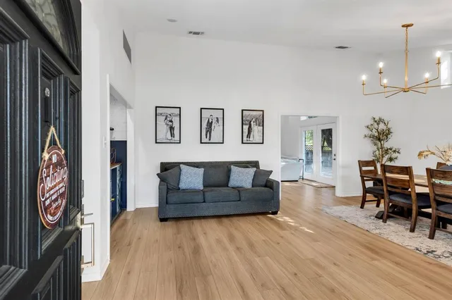 a kitchen with cabinets appliances a sink and a counter top space