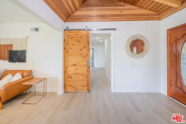 an entryway and a livingroom with furniture