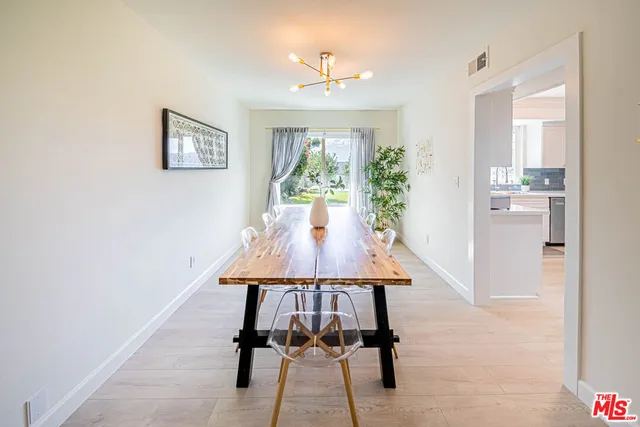 a view of a livingroom with furniture window and wooden floor
