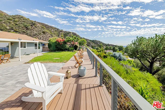 a view of balcony with wooden floor and outdoor space