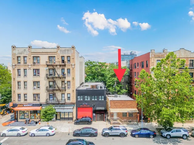 a front view of a building with street view