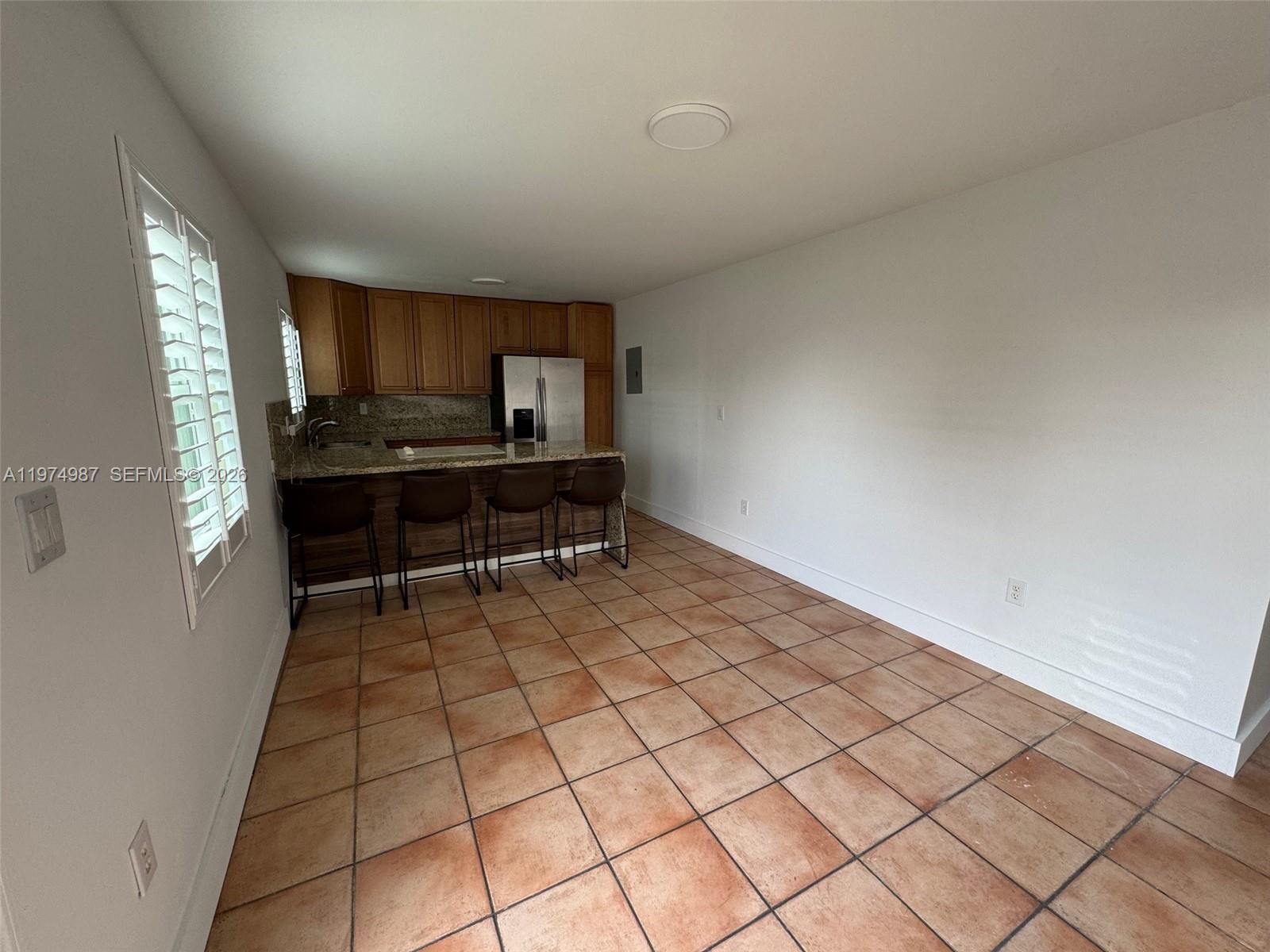 211 West 33rd Street, Unit 2 Hialeah, FL 33012 - Photo 3 of 9 a room with a sink and a window