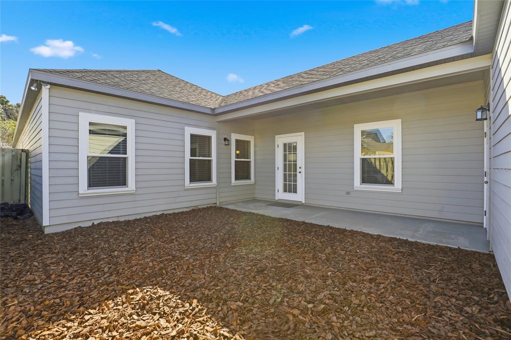 7894 Southwest 80th Drive Gainesville, FL 32608 - Photo 26 of 31 a view of house with backyard