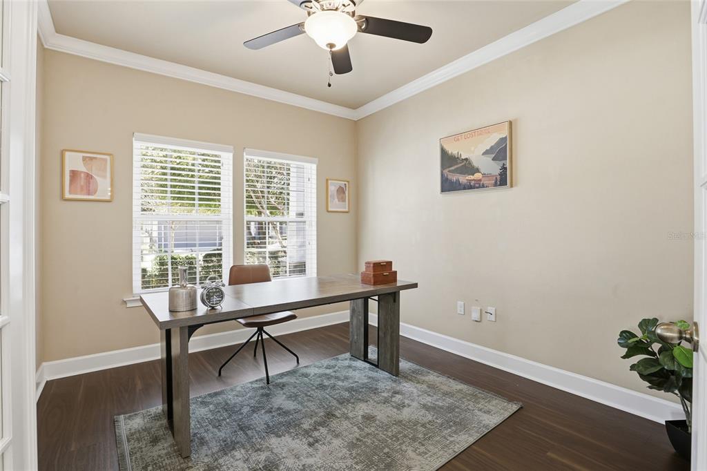 7894 Southwest 80th Drive Gainesville, FL 32608 - Photo 4 of 31 a view of a workspace with furniture and a window