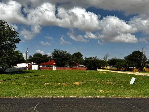 a view of a golf course with swimming pool