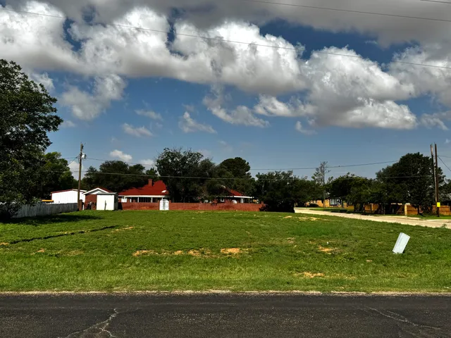 a view of a golf course with swimming pool