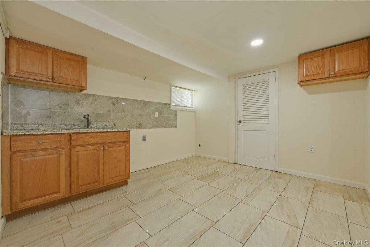 51 Hickory Road Port Washington, NY 11050 - Photo 15 of 16 Basement Wet Bar