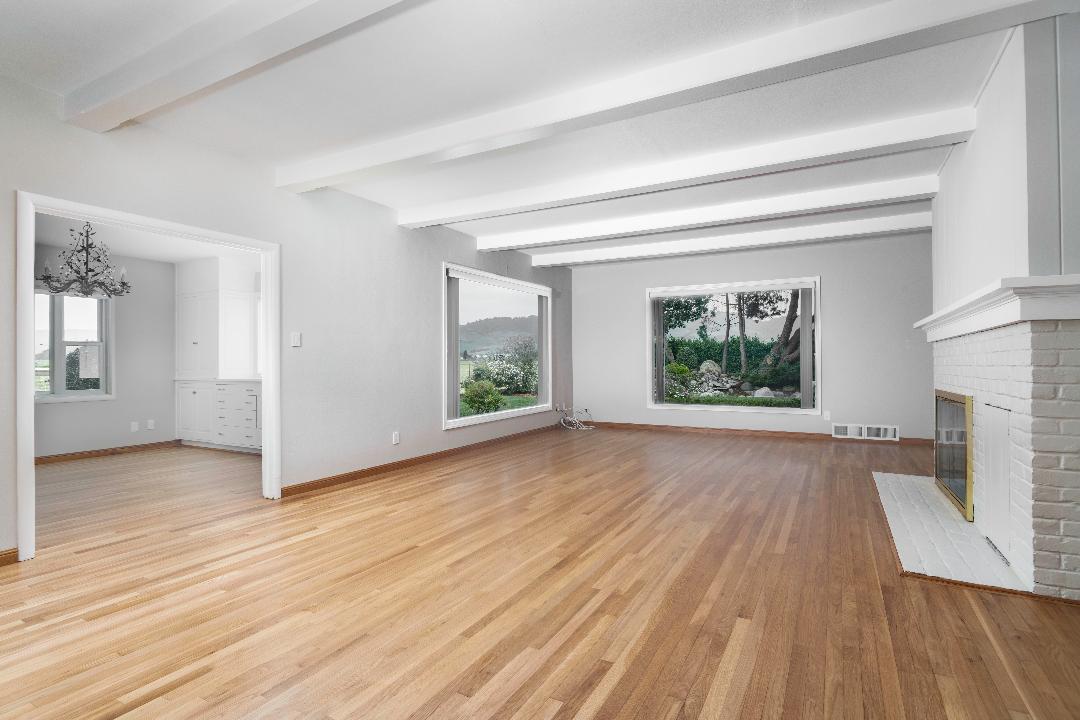 479 Riverside Road Watsonville, CA 95076 - Photo 5 of 22 a view of an empty room with wooden floor and a window