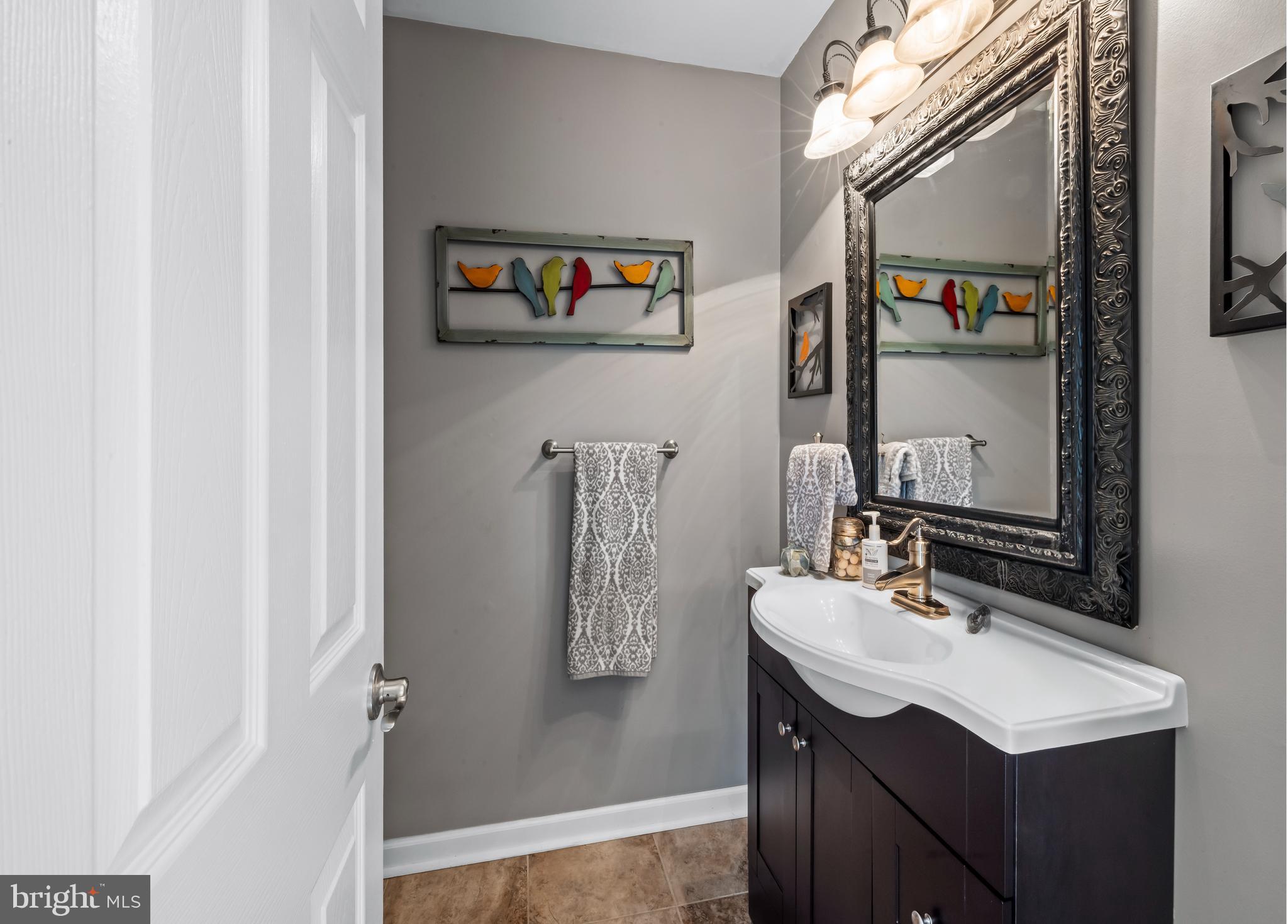 34 Borrelly Boulevard Sewell, NJ 08080 - Photo 12 of 23 a bathroom with a sink vanity and a mirror