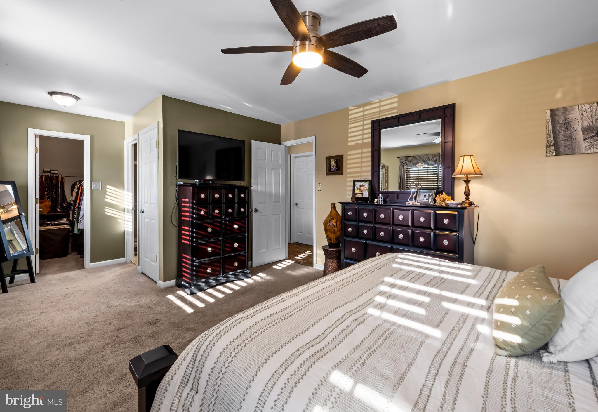 34 Borrelly Boulevard Sewell, NJ 08080 - Photo 13 of 23 a bedroom with a bed and a large mirror